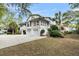 Stately home with three-car garage, lovely porches, and lush landscaping in a desirable community at 2093 Rookery Ln, Charleston, SC 29414