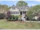 Charming home featuring a welcoming front porch, manicured landscaping, and classic architectural details at 2093 Rookery Ln, Charleston, SC 29414