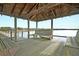 Gazebo interior provides comfortable seating and shelter with picturesque water views at 2093 Rookery Ln, Charleston, SC 29414