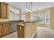 Well-appointed kitchen with granite countertops, center island, and bright eat-in area at 2093 Rookery Ln, Charleston, SC 29414