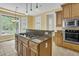 Bright kitchen featuring a center island with cooktop and pendant lighting, plus stainless appliances at 2093 Rookery Ln, Charleston, SC 29414