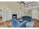 Spacious living room with fireplace, vaulted ceiling, built-in bookshelves, and staircase to second level at 2093 Rookery Ln, Charleston, SC 29414