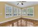 This room has wood floors, multiple large windows with plantation shutters, and ceiling fan at 2093 Rookery Ln, Charleston, SC 29414