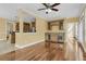 Open living space featuring a wet bar with wine fridge, hardwood floors, and access to the kitchen at 2093 Rookery Ln, Charleston, SC 29414
