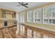 Open living space with hardwood floors, a wet bar, and a sunny view through shuttered windows at 2093 Rookery Ln, Charleston, SC 29414