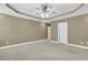 This large bedroom features a ceiling fan with lights, neutral walls, and an ensuite bathroom at 2093 Rookery Ln, Charleston, SC 29414