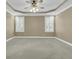 This bedroom has neutral walls, trey ceiling, ceiling fan, and two windows with plantation shutters at 2093 Rookery Ln, Charleston, SC 29414