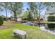 Picturesque community pond with a fountain, surrounded by lush greenery and mature trees at 2093 Rookery Ln, Charleston, SC 29414