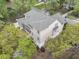 Aerial view of a spacious home, featuring a deck and a backyard surrounded by trees, ensuring privacy at 2093 Rookery Ln, Charleston, SC 29414