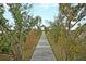 Landscaped wooden boardwalk offers a serene nature walk with scenic marshland views at 2093 Rookery Ln, Charleston, SC 29414