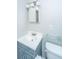 Updated bathroom featuring a modern vanity, glass shelving and a toilet at 21 Hester St # Apt 12, Charleston, SC 29403