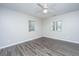 Serene bedroom featuring wood-look flooring and two windows providing ample natural light at 21 Hester St # Apt 12, Charleston, SC 29403