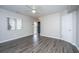 Spacious living room with modern flooring, a ceiling fan, and neutral paint, enhancing its appeal at 21 Hester St # Apt 12, Charleston, SC 29403