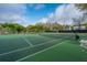 A well-maintained tennis court on a sunny day at 21 Hester St # Apt 12, Charleston, SC 29403