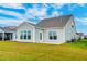 Back of home with a patio and expansive backyard lawn at 214 Garden Gate Way, Summerville, SC 29486