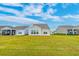 Large grassy backyard with manicured lawn at 214 Garden Gate Way, Summerville, SC 29486