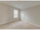 Neutral bedroom featuring a window with blinds and a small access door to additional storage at 214 Garden Gate Way, Summerville, SC 29486