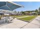 Outdoor bocce ball court with shaded seating and lush landscaping for community enjoyment at 214 Garden Gate Way, Summerville, SC 29486