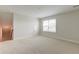 Large bonus room featuring neutral carpet, white trim, and a window with a view at 214 Garden Gate Way, Summerville, SC 29486