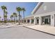 Upscale community clubhouse featuring architectural details and a social gathering area with palm trees and seating at 214 Garden Gate Way, Summerville, SC 29486