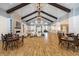 Large gathering area with fireplace, wood floors, and various seating arrangements at 214 Garden Gate Way, Summerville, SC 29486