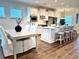 Open concept dining area featuring a large kitchen island and a dining table at 214 Garden Gate Way, Summerville, SC 29486