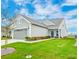Charming single-Gathering home with a two-car garage and lush green lawn at 214 Garden Gate Way, Summerville, SC 29486