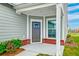 View of a gray front door with brickwork and a window to the side at 214 Garden Gate Way, Summerville, SC 29486