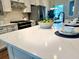 Kitchen island with white countertops, white cabinets, and stainless steel appliances at 214 Garden Gate Way, Summerville, SC 29486