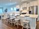 Open concept kitchen with large island with barstool seating and modern appliances at 214 Garden Gate Way, Summerville, SC 29486