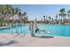 Community pool with water features, cabanas, and accessibility lift provides a relaxing and inclusive experience at 214 Garden Gate Way, Summerville, SC 29486