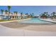 Expansive outdoor pool with beach entry, cabanas, and palm trees for a resort-style experience at 214 Garden Gate Way, Summerville, SC 29486