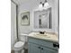 Bright bathroom featuring a modern vanity, stylish light fixture, and decorative wall art at 2196 Spoleto Ln, North Charleston, SC 29406