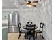 Cozy dining area with a ceiling fan and view of stainless steel refrigerator at 2196 Spoleto Ln, North Charleston, SC 29406