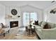 Living room with a fireplace, elegant decor, and comfortable seating area at 2196 Spoleto Ln, North Charleston, SC 29406