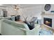 Cozy living space with a fireplace, comfortable sofa, and a dining area nearby at 2196 Spoleto Ln, North Charleston, SC 29406
