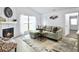 Inviting living room showcasing a fireplace, comfortable seating, and ample natural light at 2196 Spoleto Ln, North Charleston, SC 29406