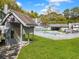 Community pool area with a pool house, manicured lawn, and mail delivery at 2196 Spoleto Ln, North Charleston, SC 29406