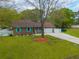 Aerial view of brick home with a spacious yard and driveway at 2233 Glendale Dr, Charleston, SC 29414