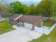 Aerial view of a brick home featuring an attached garage and fenced yard at 2233 Glendale Dr, Charleston, SC 29414