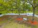 Aerial view of a backyard with a shed, swing, and mature trees at 2233 Glendale Dr, Charleston, SC 29414