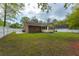Spacious backyard with a well-kept lawn, surrounded by a white fence at 2233 Glendale Dr, Charleston, SC 29414