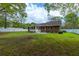 Well-maintained backyard with mature trees and a spacious lawn at 2233 Glendale Dr, Charleston, SC 29414