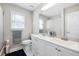 A clean bathroom featuring a double vanity, white cabinets, and a large mirror at 2233 Glendale Dr, Charleston, SC 29414