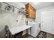 Convenient laundry room featuring a washer, dryer, and ample storage space at 2233 Glendale Dr, Charleston, SC 29414