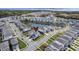 An aerial view of a community featuring a pond and multiple well-maintained, charming light blue single-Gathering homes at 2237 Tillage St, Mount Pleasant, SC 29466