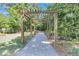 Picturesque walking path under a wooden arbor, surrounded by lush greenery and providing a tranquil escape at 2237 Tillage St, Mount Pleasant, SC 29466