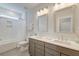 Well-lit bathroom featuring double vanity, white quartz countertops, and a combined tub and shower at 2237 Tillage St, Mount Pleasant, SC 29466