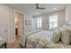 Serene bedroom with ensuite bathroom access, light wood floors, and bright sunny windows at 2237 Tillage St, Mount Pleasant, SC 29466
