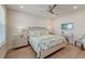 Comfortable bedroom with light wood floors, ceiling fan, and coastal-themed decor at 2237 Tillage St, Mount Pleasant, SC 29466